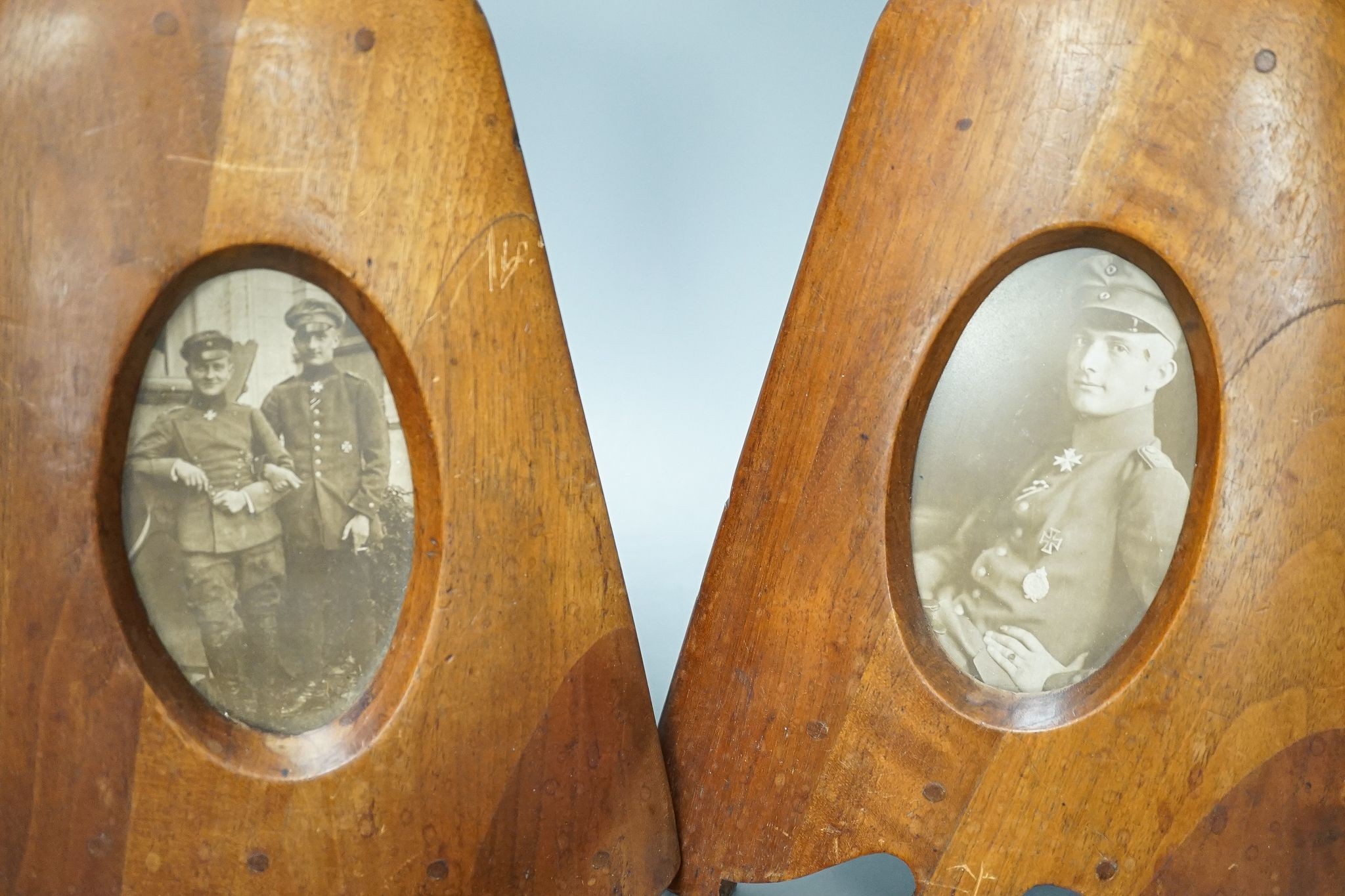 A pair of WWI German propeller frames, with pilot portraits, 28cm, and four German WW1 accessories